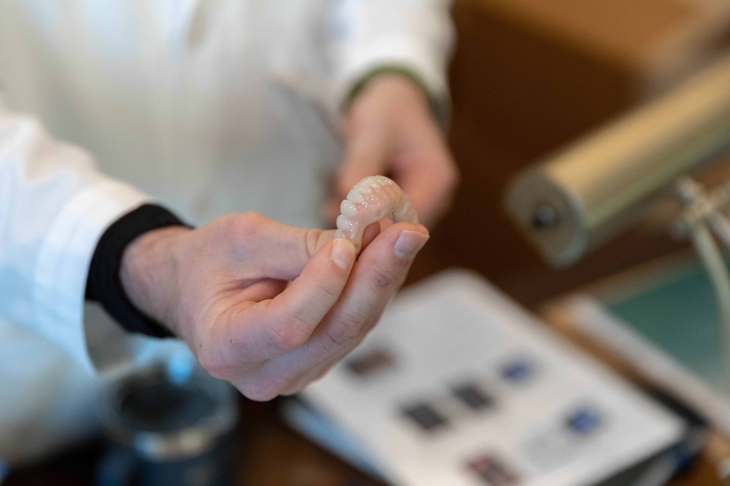 A dentist holding same day dental implants.