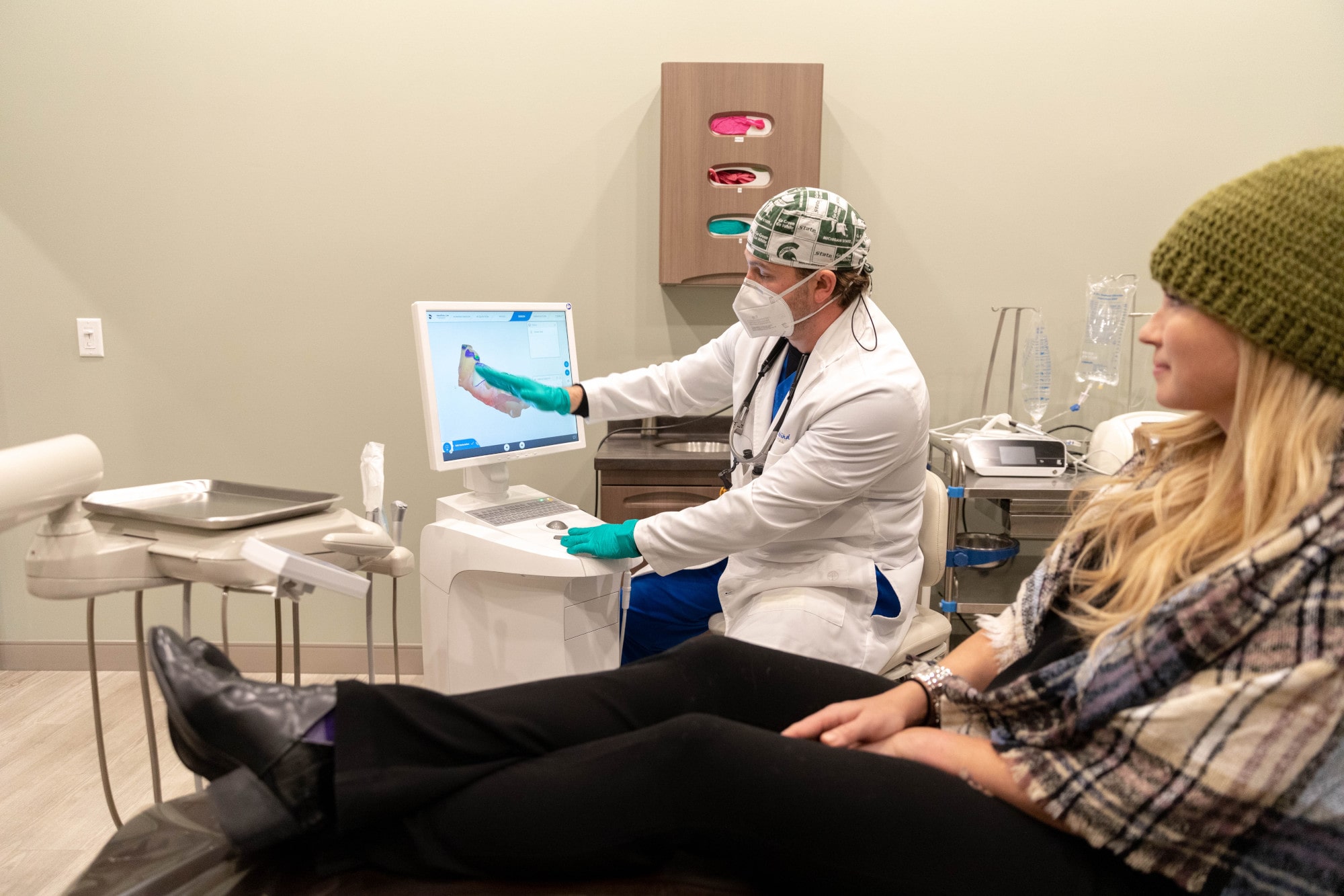 Dr. Hamilton explaining the dental implants process.